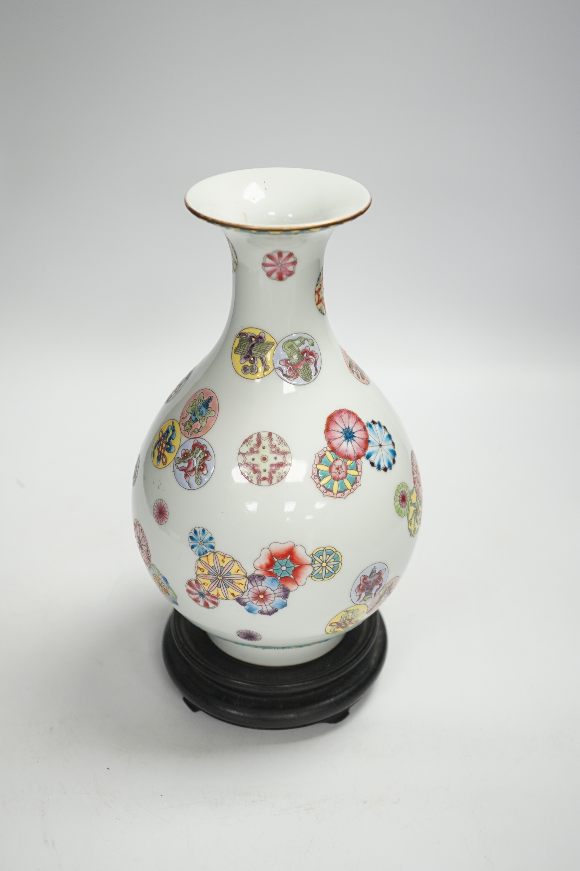 A Chinese famille rose vase, on hardwood stand, overall 27cm high